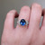 S823-FLEUR-WG-NVST3610 - Ring on Hand
