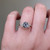 S823-FLEUR-WG-NVST3838 - Ring on Hand