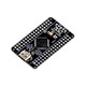 Angled shot of STM32G0B1RET6 board highlighting MCU, buttons, USB, and header pins
