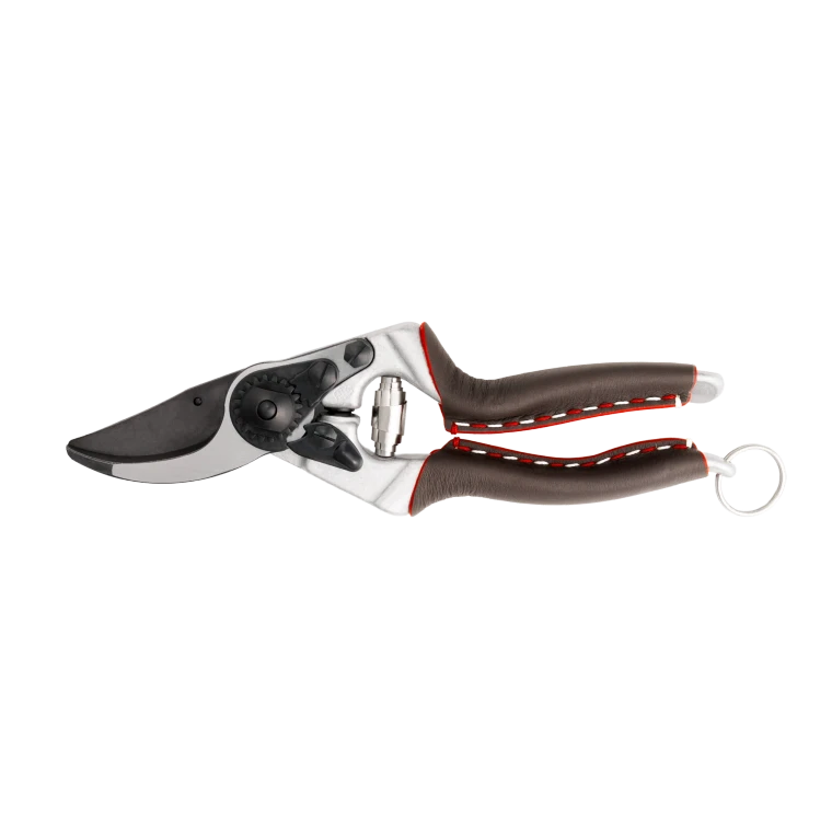 The FELCO 8 Elite Premium Pruning Shears are the luxury evolution of the world-renowned FELCO 8. Designed for professional arborists, horticulturists and passionate gardeners, they combine hand-stitched genuine leather grips, an advanced F-Tech coated hardened steel blade, and forged aluminium handles for exceptional comfort, durability and cutting performance. Designed specifically for large right-handed users, the FELCO 8 Elite delivers clean, effortless cuts up to 25mm in diameter while showcasing the finest Swiss craftsmanship.