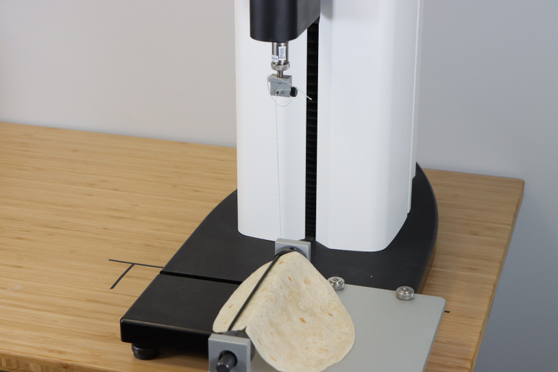 Tortilla Roll Up Fixture evaluates changes in corn tortilla texture per AACC technical paper by measuring the force to roll up a tortilla.