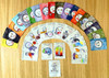 Colorful card game set, illustrated cards with various expressive faces and activities, arranged in a semi-circle on a wooden surface. Colorful card game set, illustrated cards with various expressive faces and activities, arranged in a semi-circle on a wooden surface.