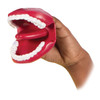 Novelty Lips and Teeth Hand Puppet, a playful red mouth puppet with white teeth and pink tongue, held by a person's hand.