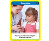 Requesting card from a children's educational game, a woman helping a young girl during an activity