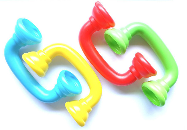 Inflatable swim rings, colorful pool floaties in blue, yellow, red, and green, for children and adults.