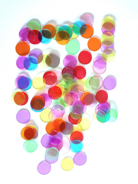 Colorful confetti, assorted circular confetti in various bright colors scattered on a white background.