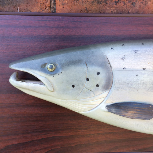Small carved  wood Salmon display mounted on board. 
