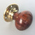 A single original rosewood bun shaped door knob/handle with brass plate.