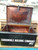 A large black vintage metal box with side carrying handles.  Lettering on the front in white : Carronvale Bulding Company No2.   A large black vintage metal box with side carrying handles.  Lettering on the front in white : Carronvale Bulding Company No2.