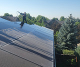 Using a cleaning brush and pole designed for solar panels makes the job easy and efficient.