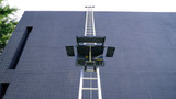 Universal platform being raised to the top of a roof