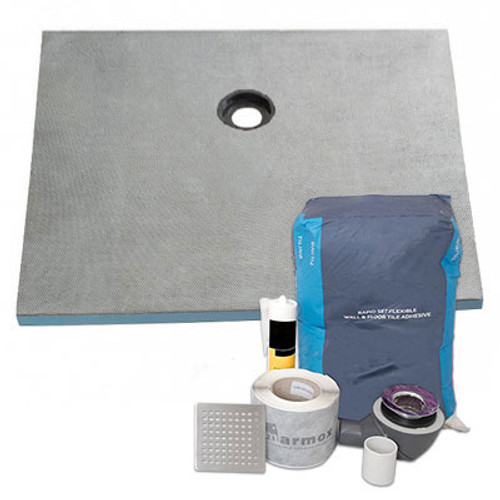 A Marmox Offset Drain Shower Tray Kit with shower tray, drain, adhesive, silicone, and waterproofing materials all in one kit.