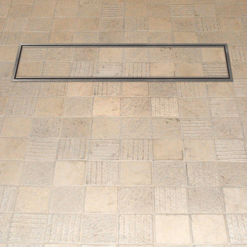 A tileable linear drain cover in a tiled wet room