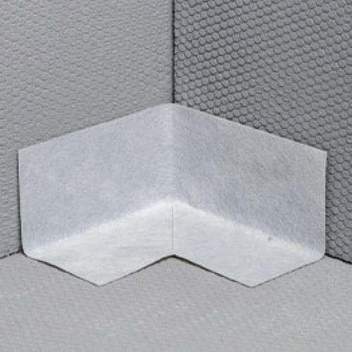 A Marmox Internal Waterproof Corner Piece used in the corner of a Marmox Multiboard installation