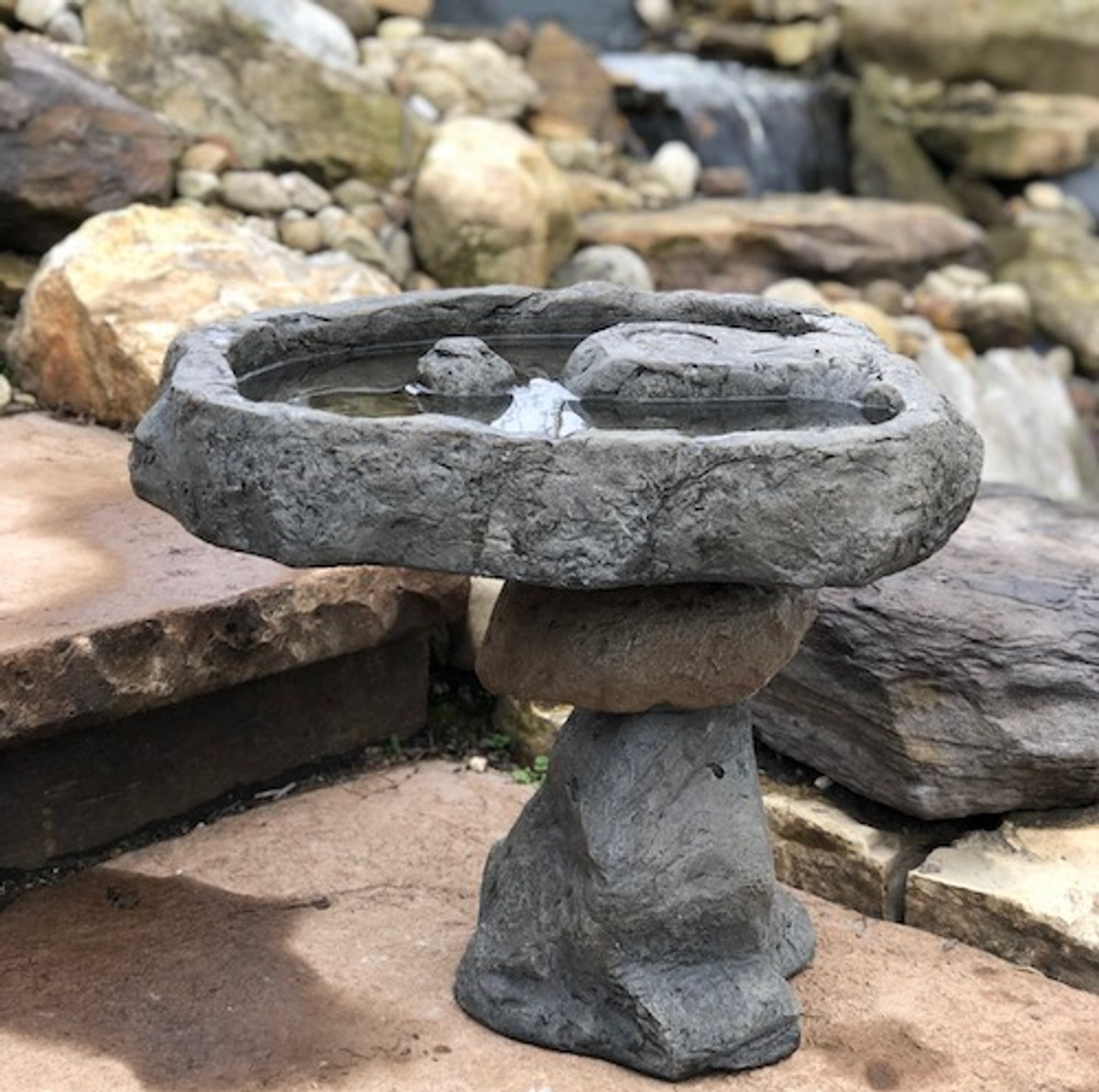Outdoor garden organic rock birdbath from Athena Garden makes wonderful Mother's Day and Father's Day gifts. This concrete balancing rock birdbath is a unique hand sculpted design that has high quality and made in the U.S.A, decorative concrete balancing rock garden birdbath, outdoor organic balancing stone bird bath, gifts for all occasions. Two Piece Balanced Stone Bird Bath, concrete bird bath, stone bird bath, cast stone bird bath, balancing rock sculpture