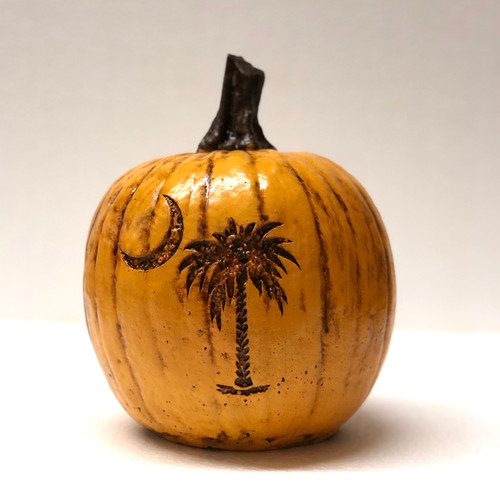 This palm tree stone pumpkin is suited for both indoor and outdoor settings. Whether it is put out seasonal as fall decor, or all year around in your landscape or home, this palmetto designed concrete pumpkin will bring happiness to all residents or vacationers that visit South Carolina. The cast stone pumpkin is hand sculpted and made in the U.S.A.