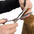 Kobe Rock Hairdressing Scissor 6 inch, professional hair cutting scissors being used to trim red hair in a salon setting.
