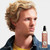 Reuzel Surf Tonic 100ml, product image showing a young man with blonde, wavy hair looking to the side with the Reuzel Surf Tonic bottle next to him.