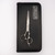 Matakki Matakki Hanma 6.0" Hairdressing Scissor, professional stainless steel scissors with textured handles and a sleek design, placed on a black leather case.