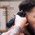 Wahl Senior 2.0 Cordless Clipper, person using the cordless hair clipper on a man's hair with detailed features and specifications.