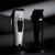 JRL 3000C Clipper, electric hair clipper with sleek black and silver design.