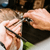 Kobe Classic 22 Left Handed Hairdressing Scissors, a professional hairstylist cutting a man's hair with precision scissors.
