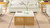 Nina 18" Cane Webbing Cube Ottoman, Ivory White Bouclé & Caramel Tan Brown Rubber Wood