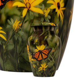 Monarch Butterfly Keepsake Urn in front of Adult Size Urn Sold Separately