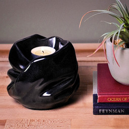 Inner Light Ceramic Tealight Urn Black on a Table