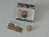 A detailed view of the keepsake box lid featuring traditional artistic portraits, perfect for storing precious items.