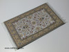 A traditional Oriental rug design computer mouse pad presented as an upscale promotional token for executive clients.
