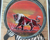 "The Savannah Safari" coaster set shown as a prestigious decorative accessory on a modern luxury coffee table in Dubai.