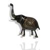 "The Golden Matriarch" brass elephant shown as a prestigious decorative feature on a modern luxury executive desk in Dubai.