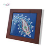 A detailed close-up highlighting the glossy glazed finish and intricate traditional paisley pattern colors of the decorative ceramic art piece