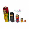 The Arabian nesting dolls displayed on a wooden table in a home setting, demonstrating their use as cultural decor.