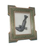 Detailed view of a classic Omani Khanjar, a symbol of heritage, displayed within an ornate mosaic-inlaid wall frame.