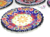 A vibrant set of 6 Turkish pottery plates, ideal for serving snacks, dips, or decorative home display.