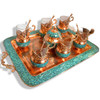 A complete Persian tea set featuring turquoise inlay on copper, including a tray, sugar bowl, and glass holders
