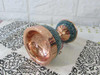 A luxury Persian pedestal nut bowl featuring brilliant turquoise inlay on a polished copper surface
