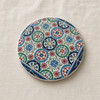 An exclusive Craftihouse 9 cm printed ceramic coaster designed to bring Andalusian and Mediterranean ceramic tile art and tabletop protection to luxury settings.