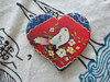A premium Craftihouse heart magnet, combining practical utility with vibrant, traditional Persian-inspired artistic detailing.