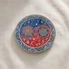 An exclusive Craftihouse 9 cm printed ceramic coaster designed to blend harmonious dualist philosophy with traditional oriental illumination art for luxury tabletop settings.
