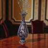 Front view of a 25 cm premium copper vase showcasing traditional hand-carved diamond-cut engraving artwork over a rich navy blue baked enamel canvas.