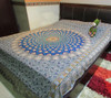 A vibrant 280x180 cm artisan cotton bedsheet featuring a striking blue central Ghalamkari medallion, intricate paisley patterns, and traditional borders.