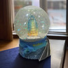 A professional product presentation of the exclusive Dubai souvenir snow globe from a premier UAE shop.