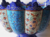 Detailed close-up of the delicate blue enamel work on our handcrafted copper bowl and plate serving set.