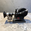 A 23 cm long decorative metal model of a vintage cinema camera with industrial-style detailing.