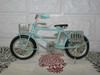 Detailed view of the intricate metalwork on our miniature bicycle shelf decoration.