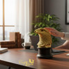 Gold plated falcon head decorative statue with wooden stand