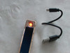 Close-up view of the printed camel graphic and Dubai text detail on modern rechargeable electronic lighters.